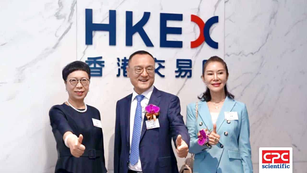 President Theresa Cheng, CEO Shawn Lee, and Medtide CEO Vickie Xu pose at the Hong Kong Stock Exchange (HKEX) during Medtide's 2025 IPO